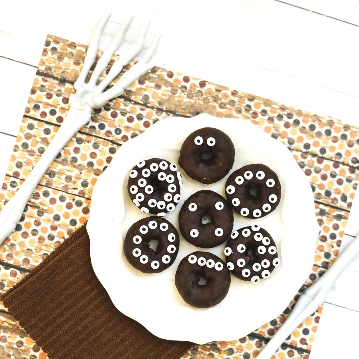 Donuts covered in chocolate and decorative eyes