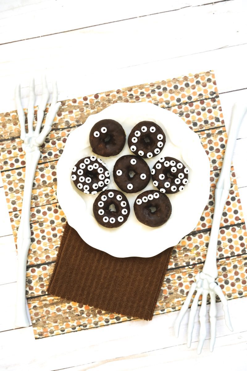 chocolate donuts with candy eyes and skeleton hands